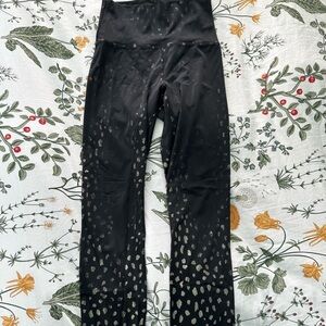Small Beach Riot black and gold spotted leggings. Great piece, very comfortable.